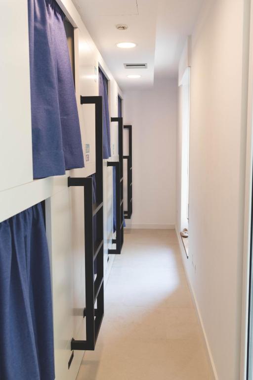 Postel nebo postele na pokoji v ubytování Hostel Villa Miguela