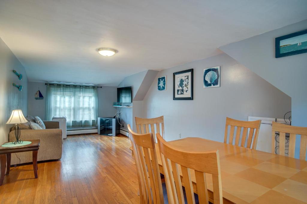 a dining room and living room with a table and chairs at 1 Mi to Windmill Beach South Yarmouth Apt! in Yarmouth