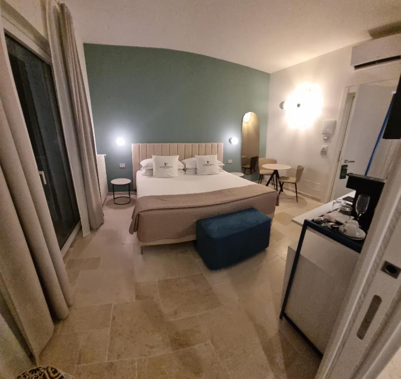 Postel nebo postele na pokoji v ubytování Suites Dimora Garibaldi