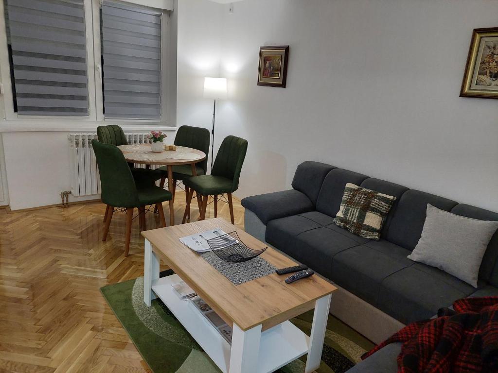 a living room with a couch and a table at DAN 9 in Sombor