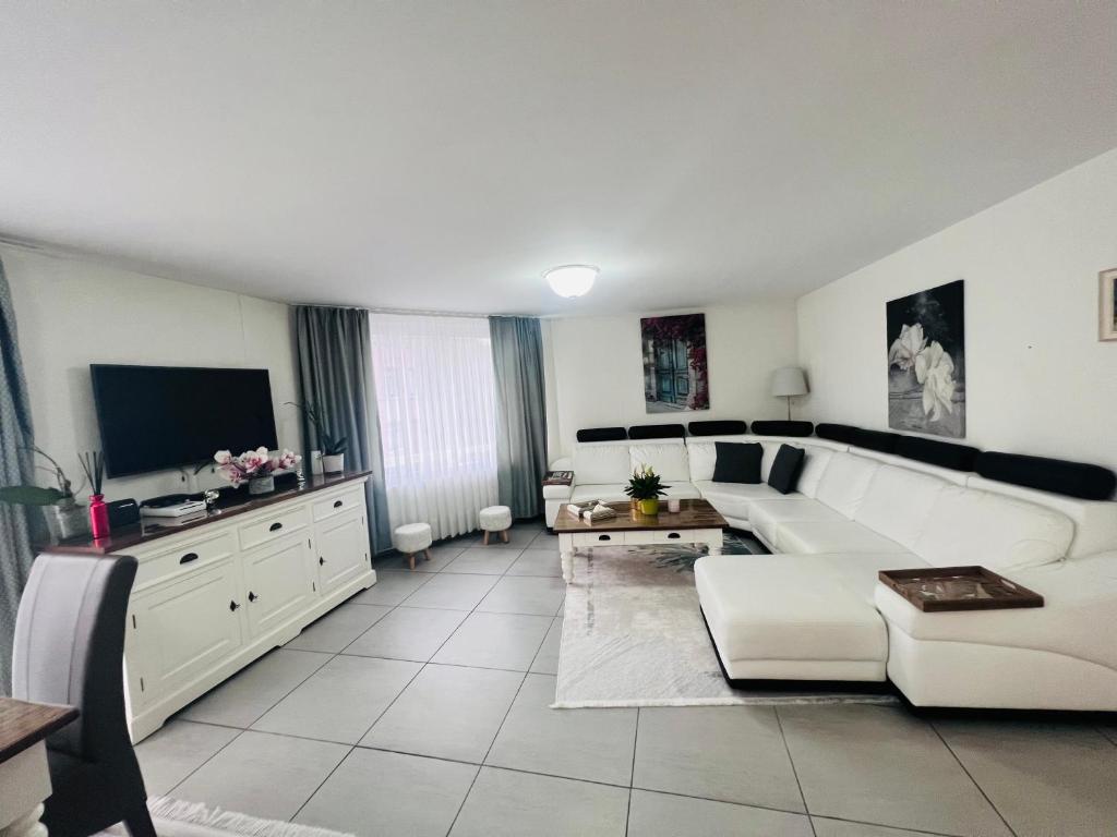 TV a/nebo společenská místnost v ubytování Windsor Residence Grimbergen