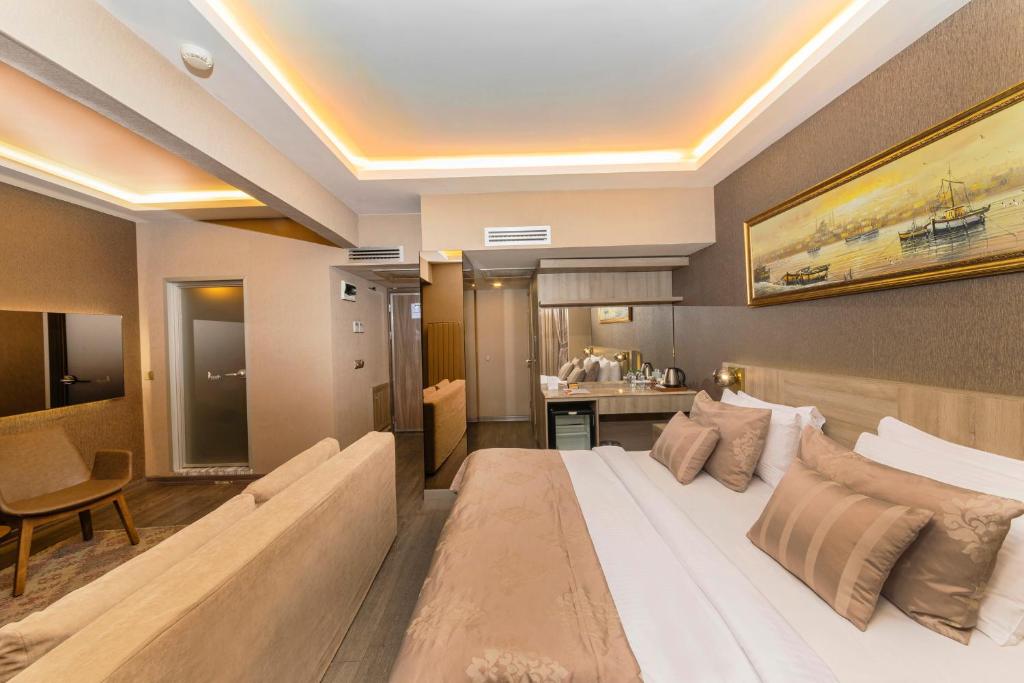 Postel nebo postele na pokoji v ubytování Ayramin Deluxe Hotel Taksim