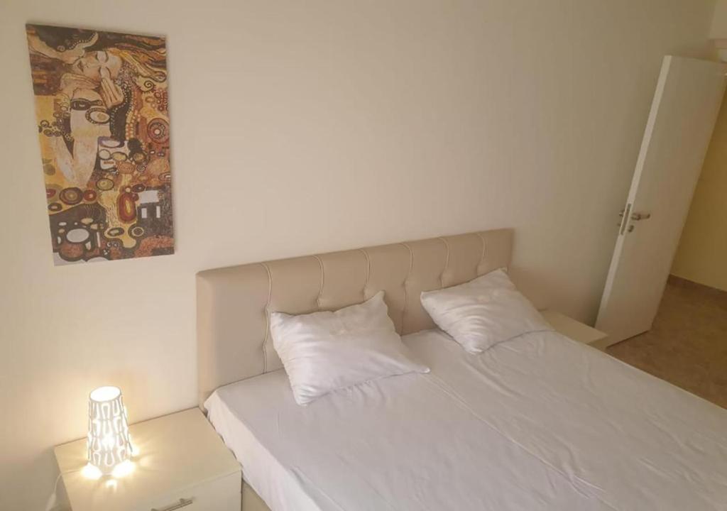 Postel nebo postele na pokoji v ubytování Hayat Apartments