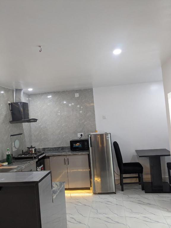 Kuchyň nebo kuchyňský kout v ubytování Easyinn Shortlet Apartment