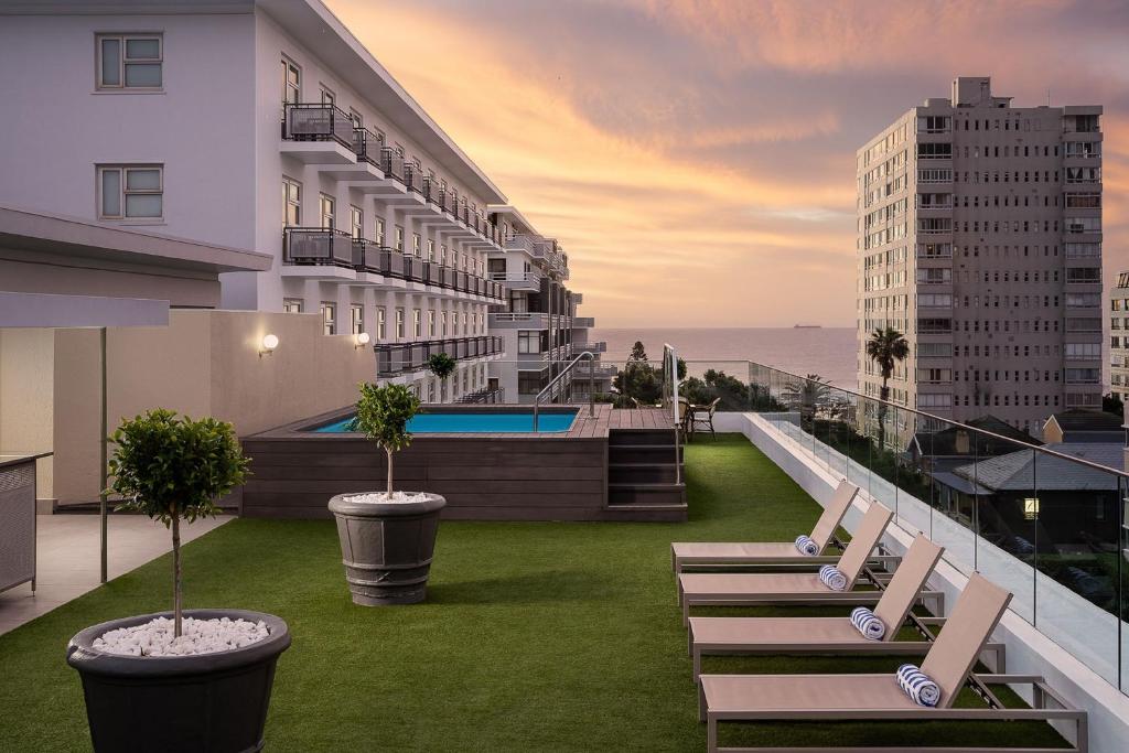 a row of chairs on the roof of a building at Protea Hotel by Marriott Cape Town Sea Point in Cape Town