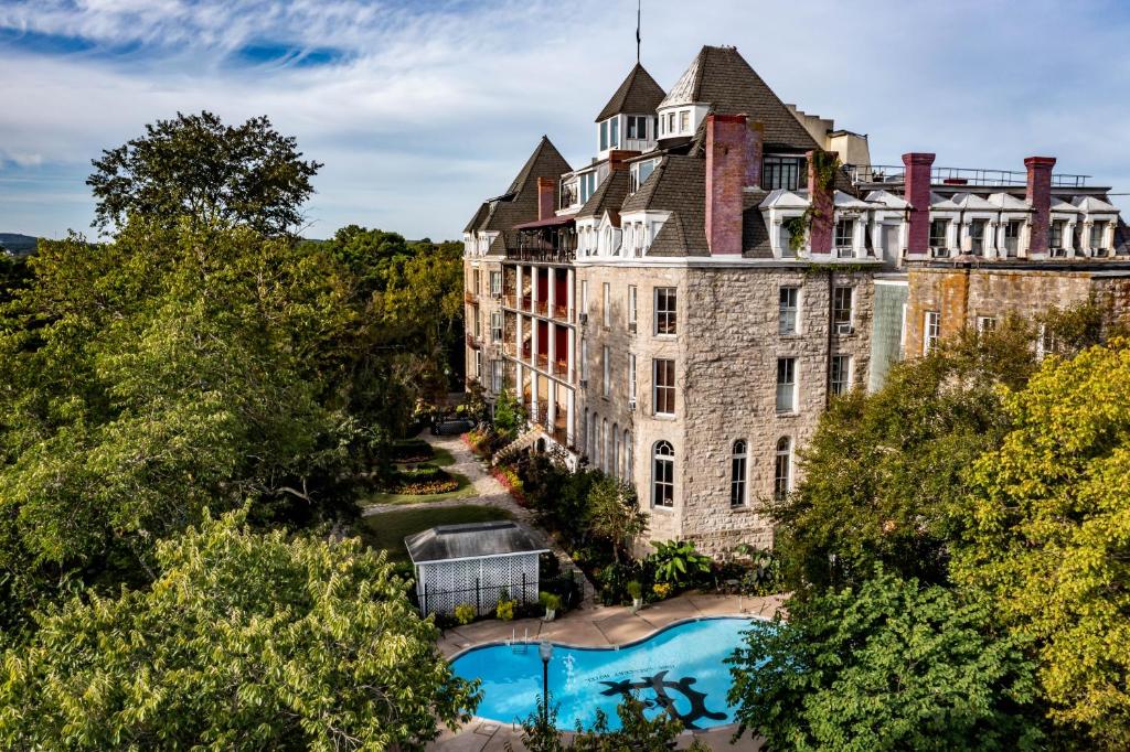 an aerial view of a building with a swimming pool at 1886 Crescent Hotel and Spa in Eureka Springs