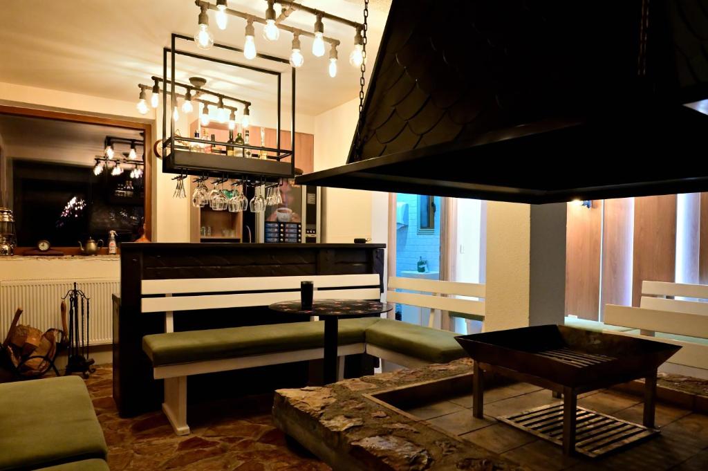 a living room with a piano and a couch at Vila Danica in Jahorina