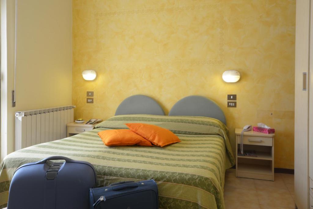 Postel nebo postele na pokoji v ubytování Albergo Martini
