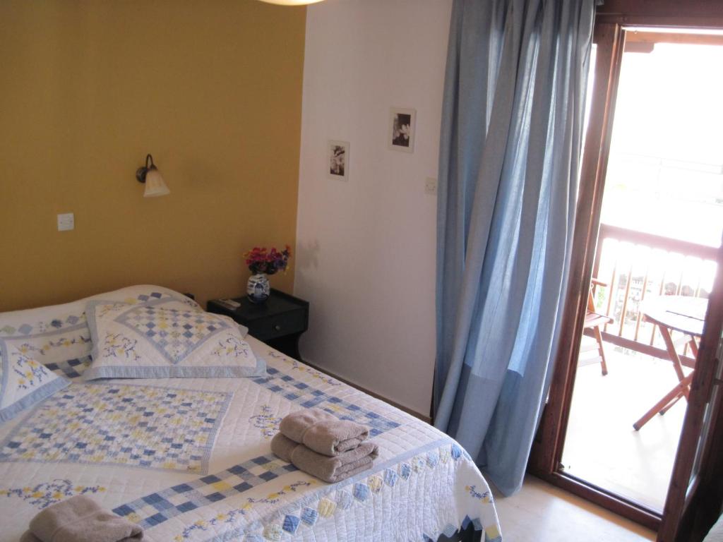 Postel nebo postele na pokoji v ubytování Mouria Hotel