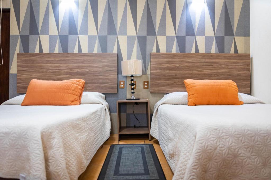 Postel nebo postele na pokoji v ubytování Hotel Estefania