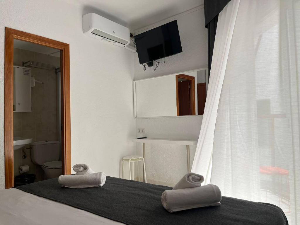 Postel nebo postele na pokoji v ubytování Hotel Maremagnum