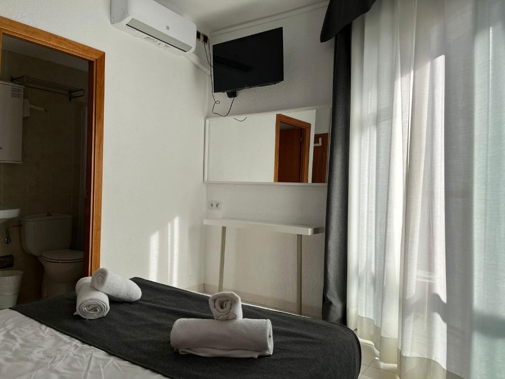 Postel nebo postele na pokoji v ubytování Hotel Maremagnum