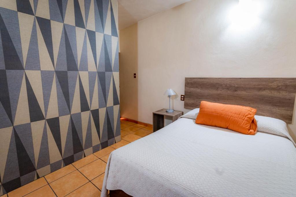 Postel nebo postele na pokoji v ubytování Hotel Estefania