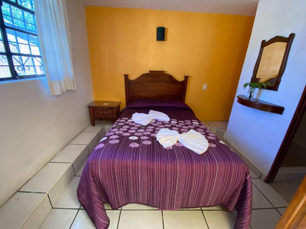 Postel nebo postele na pokoji v ubytování HOTEL CAMELINAS AREA BLANCA