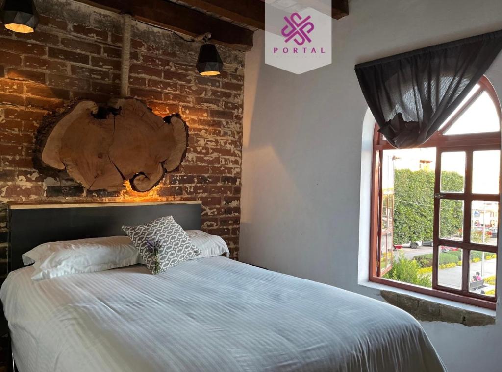 Postel nebo postele na pokoji v ubytování Hotel Portal & Suites