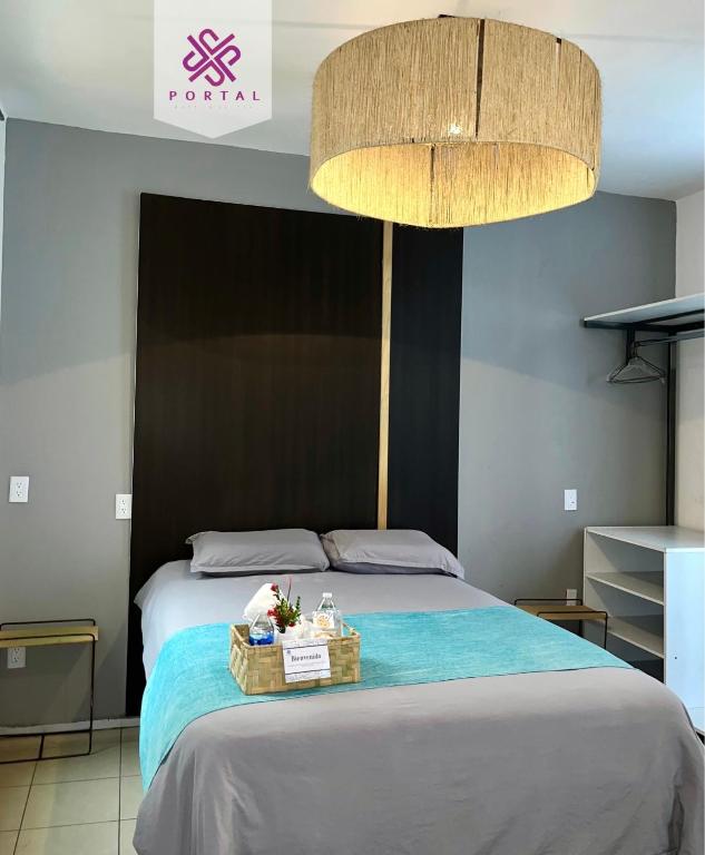 Postel nebo postele na pokoji v ubytování Hotel Portal & Suites