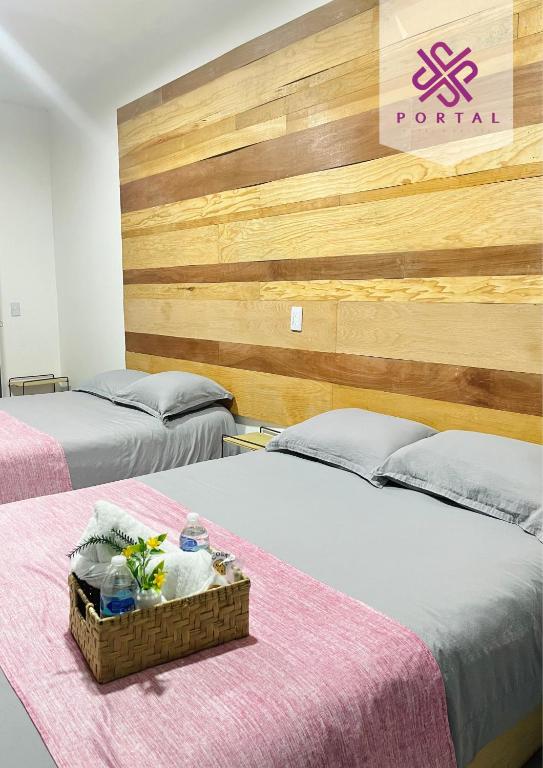 Postel nebo postele na pokoji v ubytování Hotel Portal & Suites