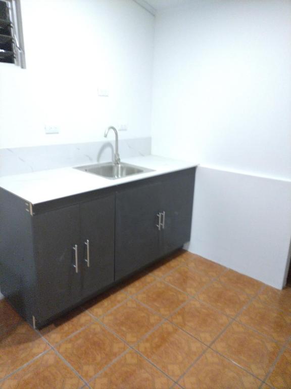 a kitchen with a sink and a counter at CONAB in Arenilla