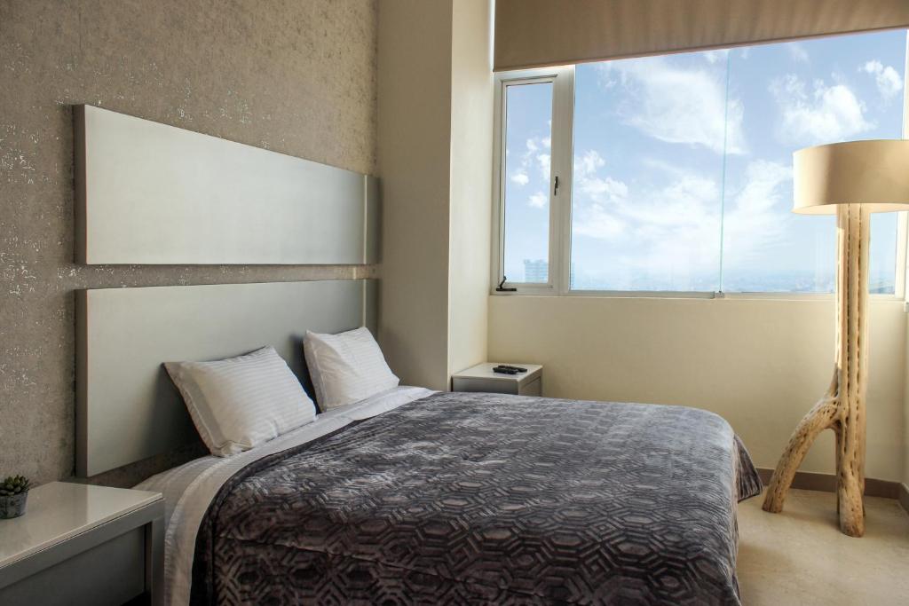 Letto o letti in una camera di Laviu B&B Luxe Suites