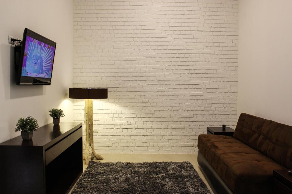 TV o dispositivi per l'intrattenimento presso Laviu B&B Luxe Suites