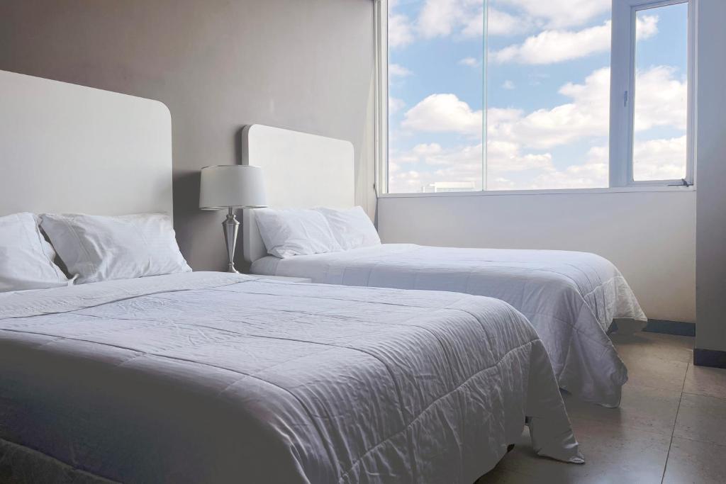 Letto o letti in una camera di Laviu B&B Luxe Suites