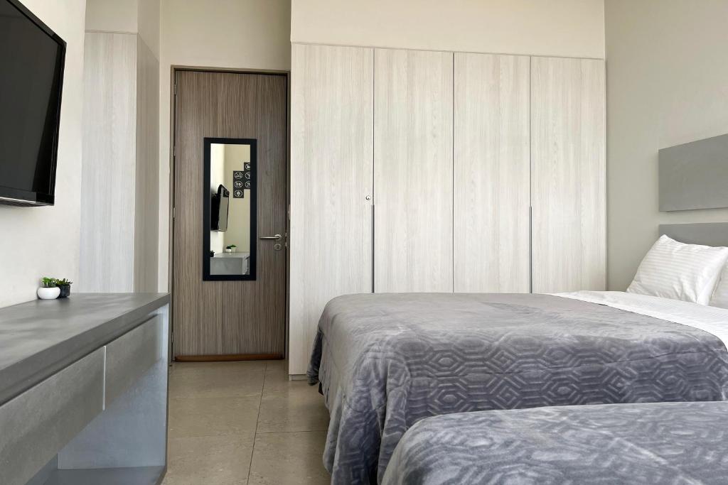 Letto o letti in una camera di Laviu B&B Luxe Suites