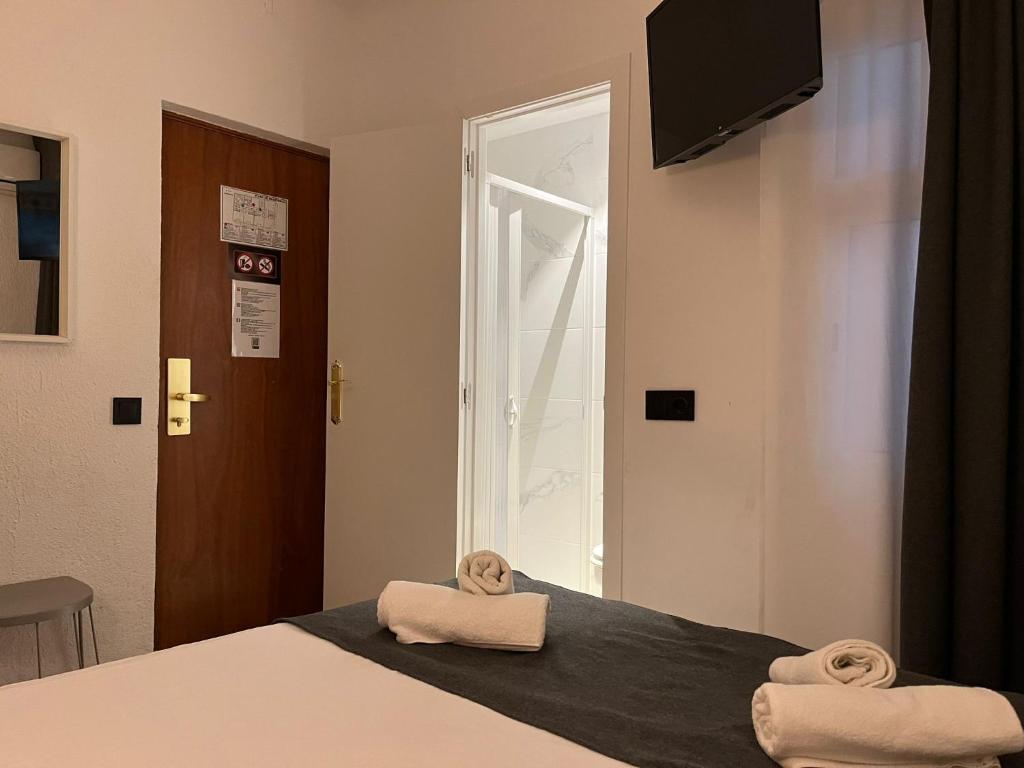 Postel nebo postele na pokoji v ubytování Hotel Maremagnum