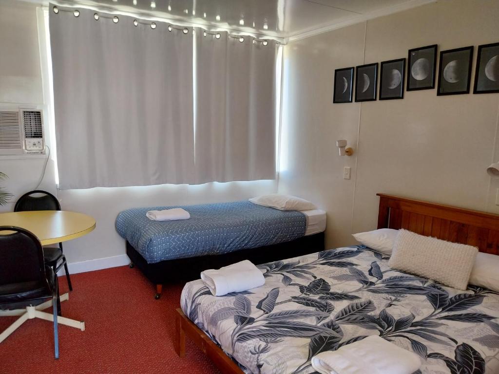 Postel nebo postele na pokoji v ubytování Motel Blackall