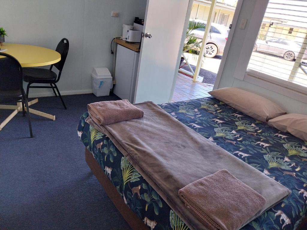 Postel nebo postele na pokoji v ubytování Motel Blackall