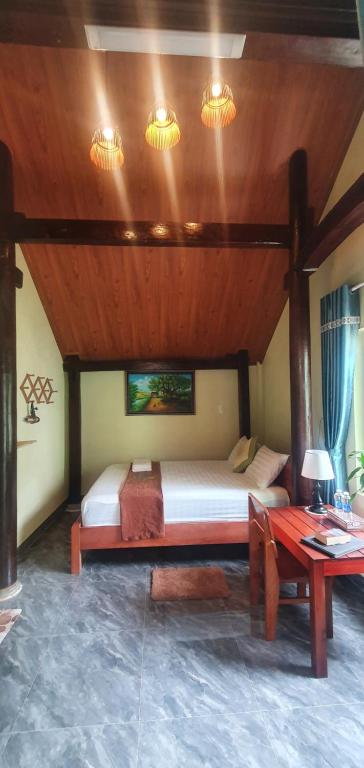 Postel nebo postele na pokoji v ubytování Tam's Homestay