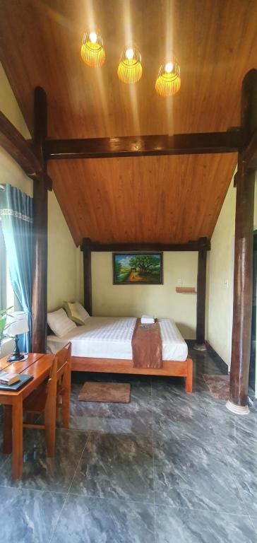 Postel nebo postele na pokoji v ubytování Tam's Homestay