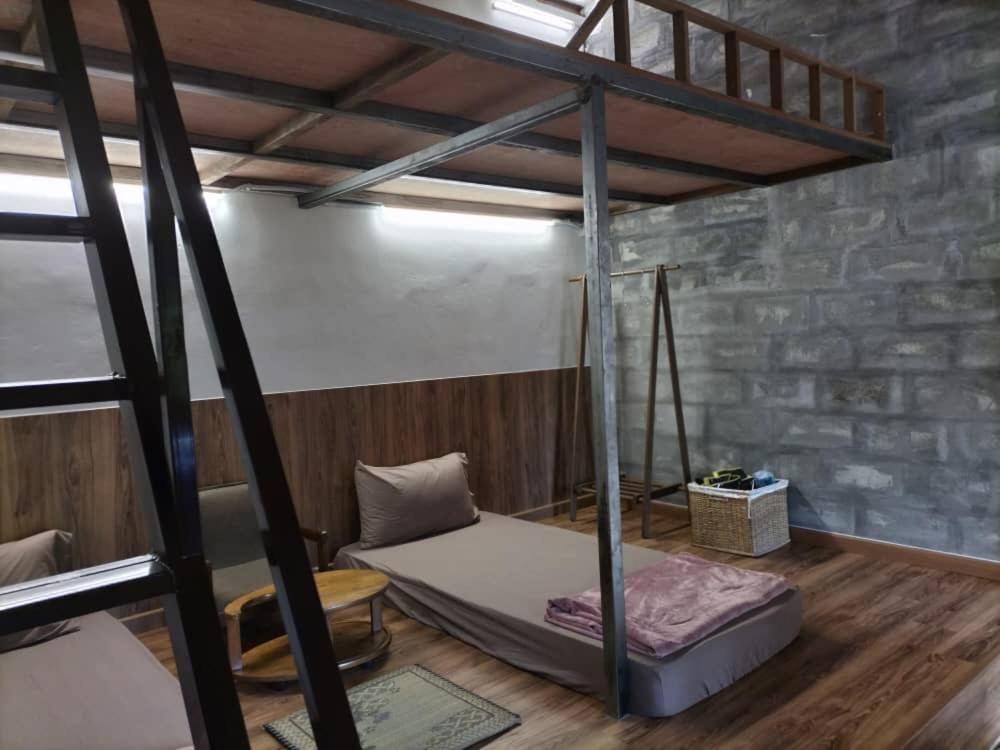 a bedroom with a bunk bed in a room at E HOME 2 KULAI-Tatami house in Kulai