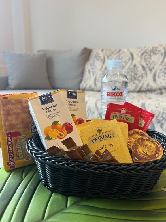 a basket filled with food on a table at EVa's Luxury Apartments No 3 in Áyios Spirídhon
