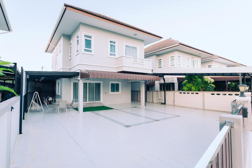 a house with a large courtyard in front of it at AABAN House 01 in Hat Yai