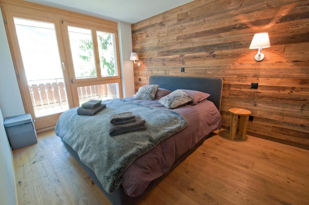 Postel nebo postele na pokoji v ubytování Z Suite Zermatt