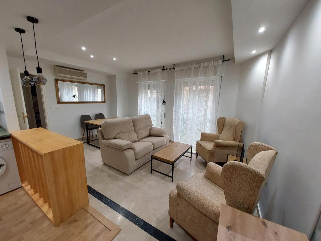 a living room with a couch and chairs and a table at Granada Centro Congresos in Granada