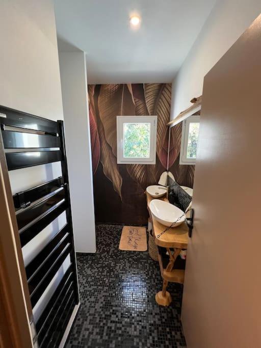a small bathroom with a sink and a toilet at Villa moderne 3 chambres double , proche de la mer, le Micocoulier quartier sainte Marguerite in La Garde