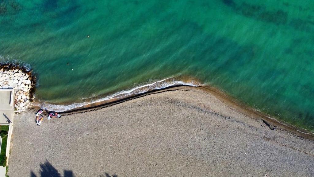 an overhead view of a beach with the ocean at Oltremare in Bari