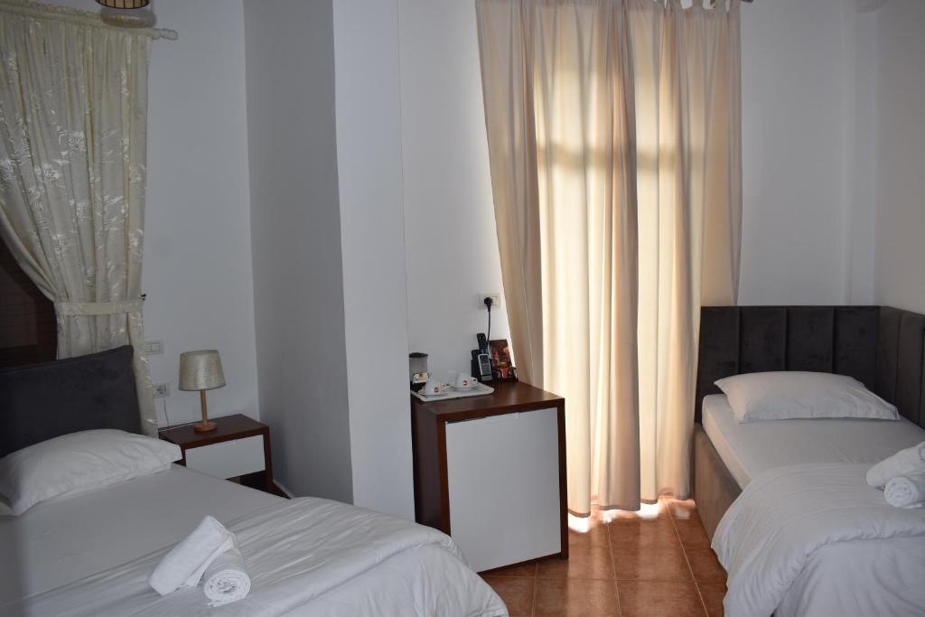 Postel nebo postele na pokoji v ubytování COSMO Beach Hotel