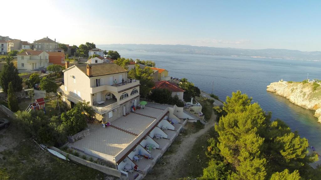 an aerial view of a building next to the water at Anka Studios in Vrbnik