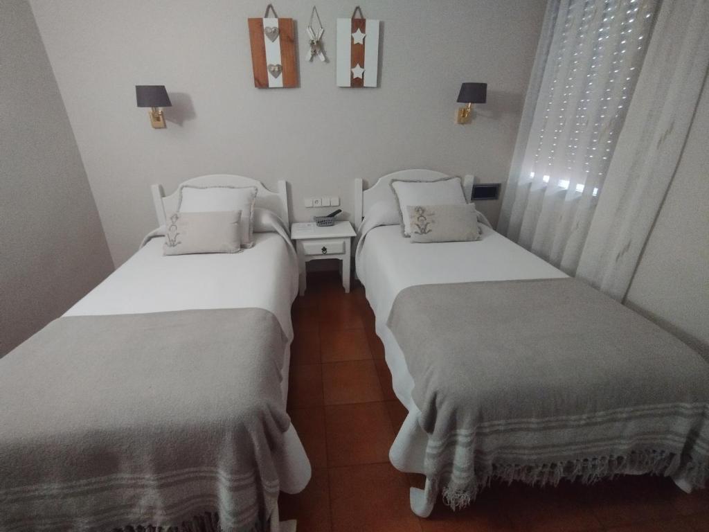 Postel nebo postele na pokoji v ubytování Hotel Ostau d'Òc