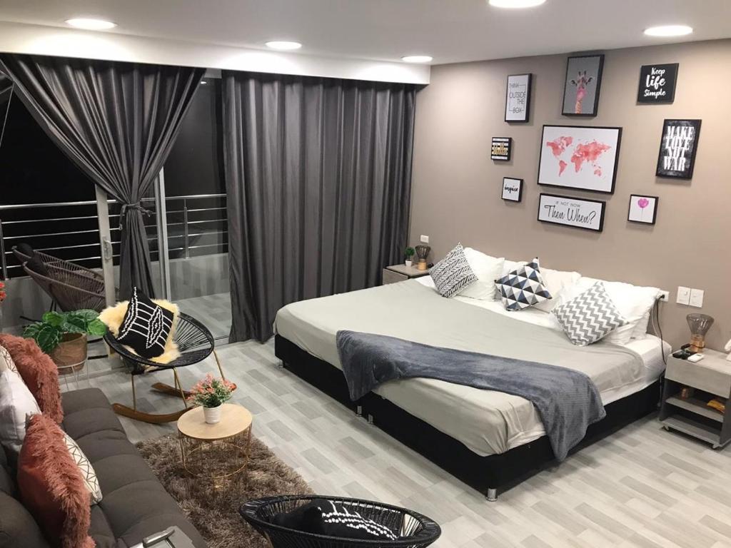 Bahia 79 Apartasuites Cerca al Centro客房内的一张或多张床位