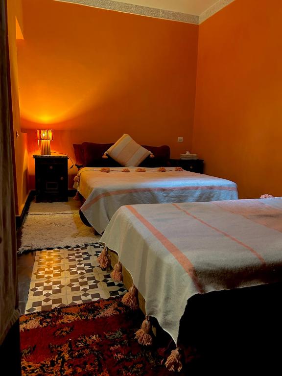 Postel nebo postele na pokoji v ubytování RIAD GALIYA