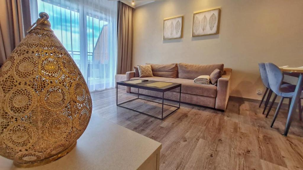 a living room with a couch and a table at HOLIDAY HOME Bel Mare 514e in Międzyzdroje