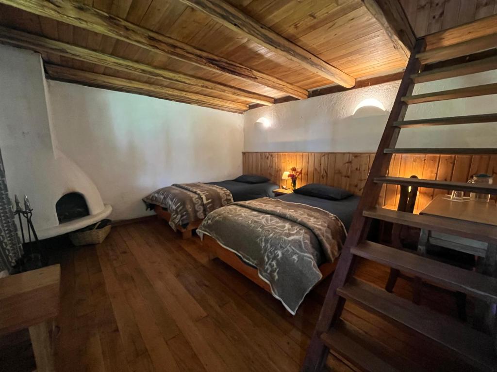 Postel nebo postele na pokoji v ubytování Hostería Hotel Cuello de Luna - Cotopaxi - Country Inn
