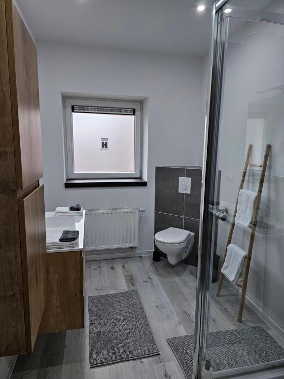 Baðherbergi á Appart'Hôtel Trazegnies