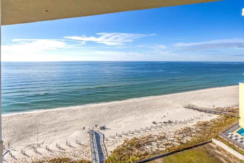 an aerial view of a beach with chairs and the ocean at Perdido Sun Resort 1108 by PKRM in Pensacola