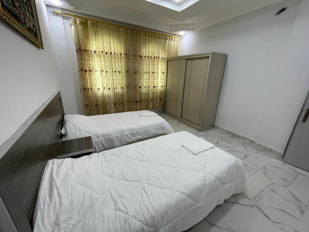 Postel nebo postele na pokoji v ubytování Oskar Appartment