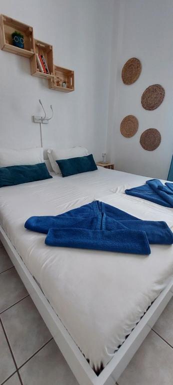 Postel nebo postele na pokoji v ubytování Kato Yialos Paros