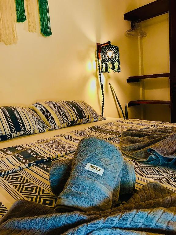 Postel nebo postele na pokoji v ubytování Residencial Bem-te-vi
